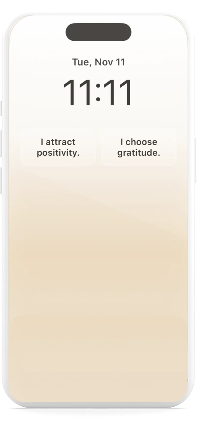 iPhone lock screen at 11:11 with twin widgets “I attract positivity” and “I choose gratitude”
