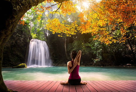 Yogasana meditation near the waterfall